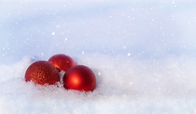 christmas background Christmas tree toys and cones in the snow