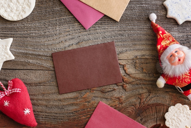 Christmas background concept. Multicolored envelopes. Christmas tree branches with cones.