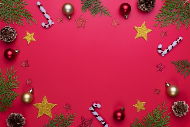 Christmas background concept. Top view of Christmas decoration on red background.