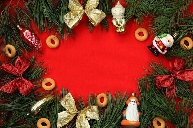 Christmas background for congratulations fir branches and retro Christmas decorations bows and bagels Holiday concept