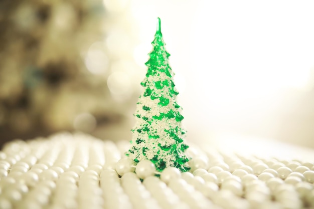 Christmas background Dish in the shape of a Christmas tree with balls decorations on the table