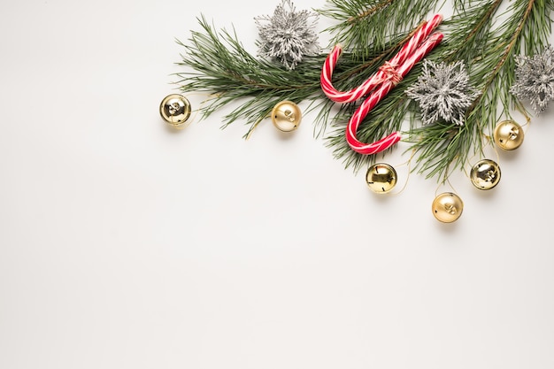 Christmas background. Fir branches and decorations on a white table