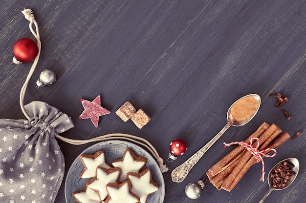 Christmas background in grey, white and red on dark wood