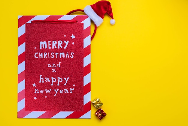 Christmas background.Lettering Merry christmas and happy new year on a red light wooden board