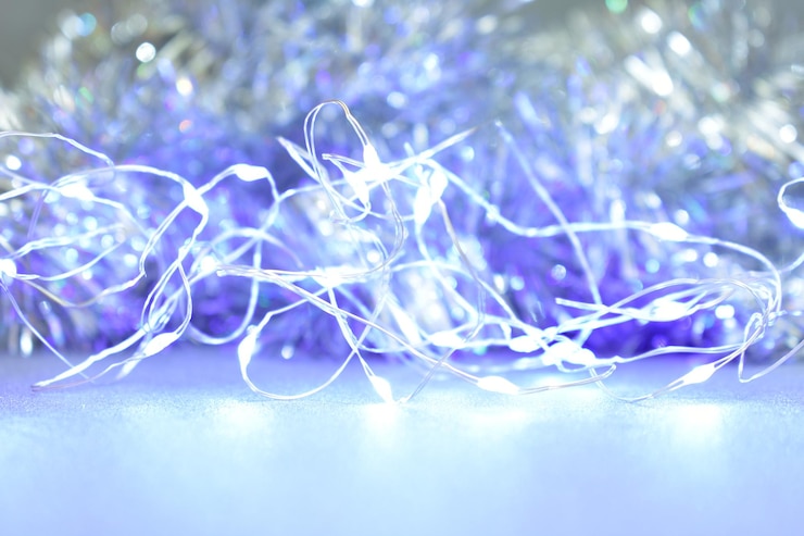 Photo 輝く青い糸で作られたクリスマスの背景