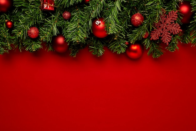 Christmas background made with garlands on a red background