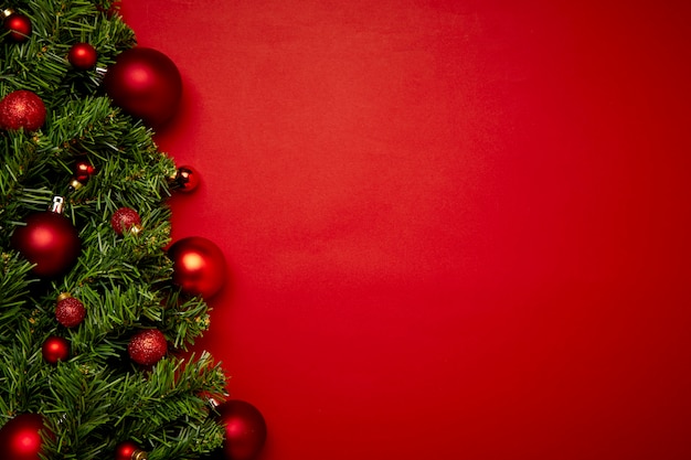 Christmas background made with garlands on a red background