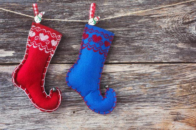 Christmas background. Old wooden background and Christmas socks. Toned