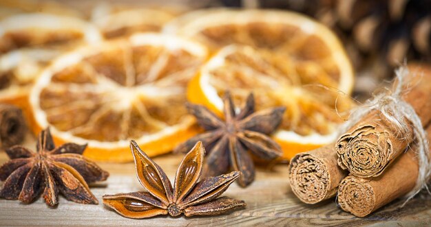 Christmas background Slices of dried oranges and spices