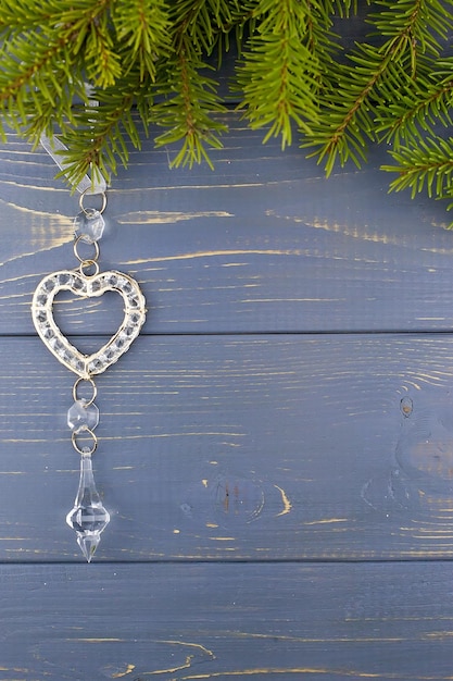 Christmas background Spruce branch on a wooden background Focus on the branch