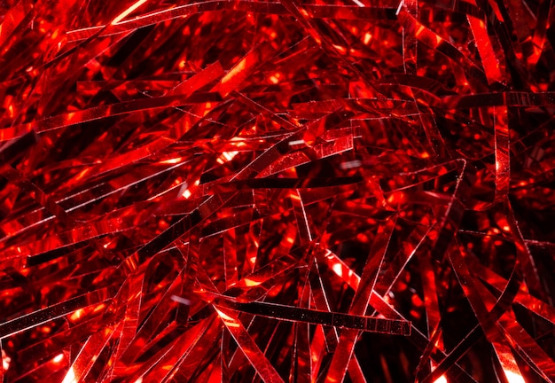 Christmas background texture of red shiny tinsel