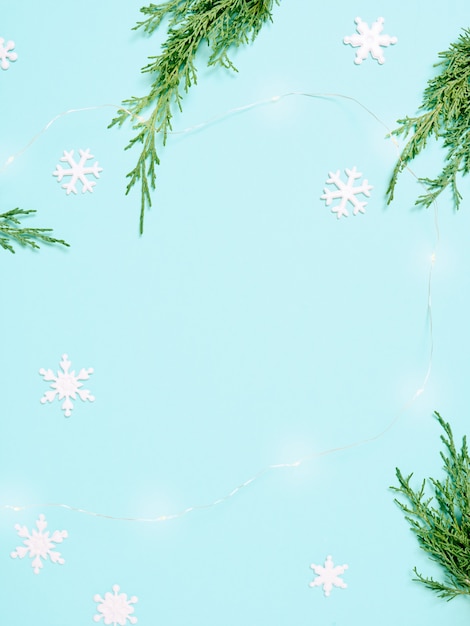 Christmas background. Top view of Christmas decorations. Flat lay of creative design on blue background. Copy space for text.