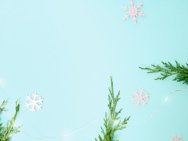 Christmas background. Top view of Christmas decorations. Flat lay of creative design on blue background. Copy space for text.