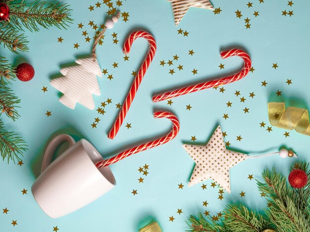 Christmas background white mug Christmas tree star fir branches sparkle in the form of golden stars