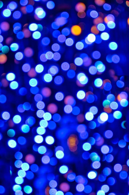 Christmas background with bokeh of colored lights.