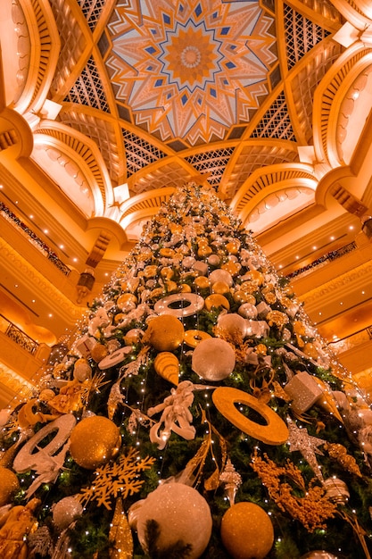 Christmas background with Christmas tree and lights. The light bulbs on the Christmas tree with beautiful celebration background