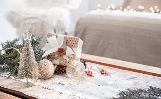 Christmas background with decor details on a blurred background with bokeh lights, copy space.