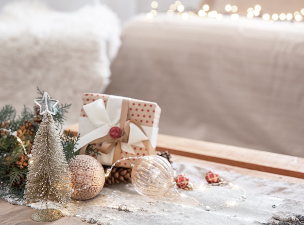 Christmas background with decor details on a blurred background with bokeh lights, copy space.