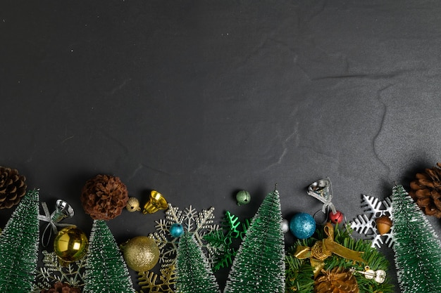 Christmas background with decorations on black stone table