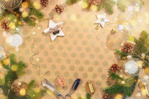 Christmas background with decorations on craft paper in rustic style With bokeh lights