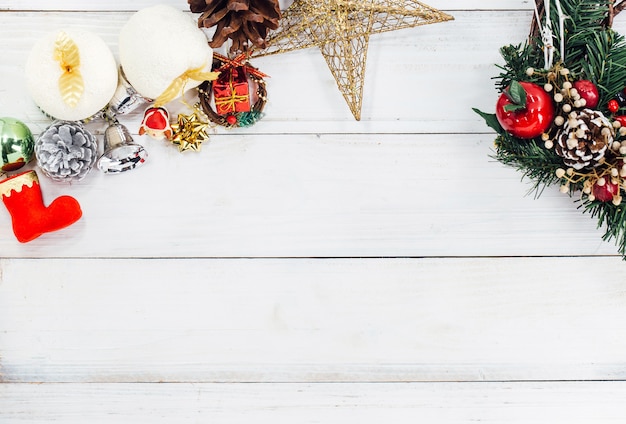 Christmas background with decorations and gift boxes on wooden