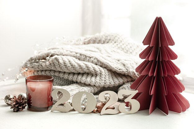 Christmas background with decorative numbers 2023 and cozy details