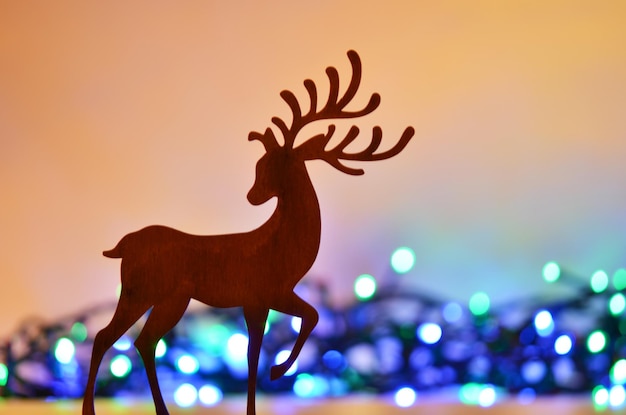 Christmas background with deer silhouette