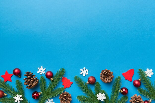 Christmas background with fir branches and Christmas decor. Top view, copy space for text