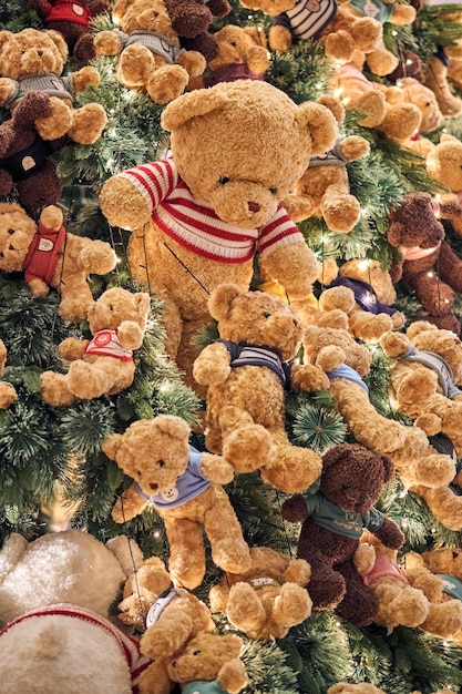 Christmas background with gift boxes under the Christmas tree and teddy bear decoration