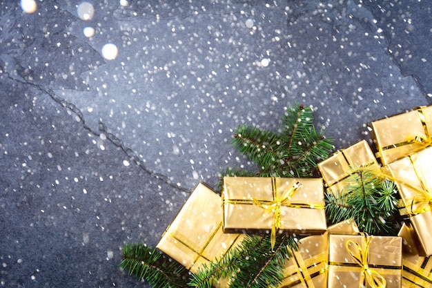 Christmas background with golden gift boxes 