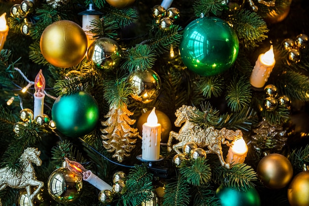 Christmas background with golden toys and candle garland