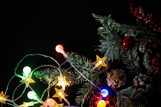 Christmas background with lights and a Christmas tree branch