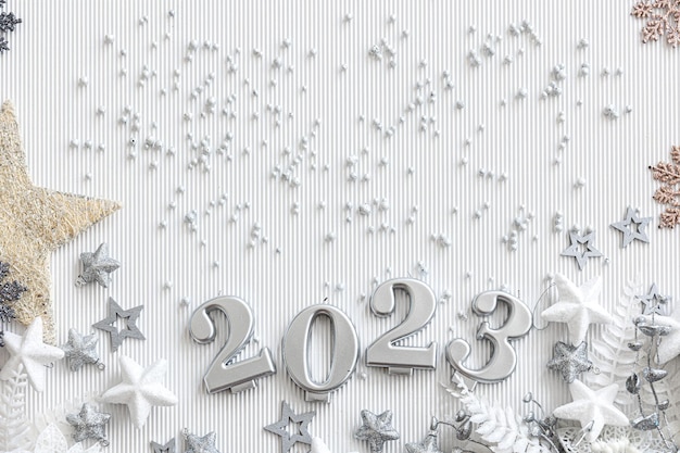 Christmas background with numbers 2023 and decor on a white background