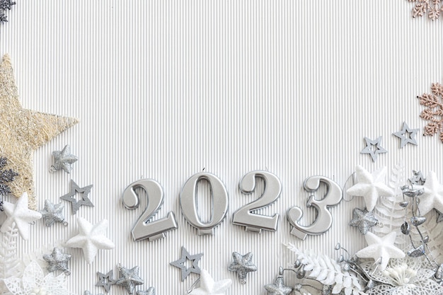 Christmas background with numbers 2023 and decor on a white background