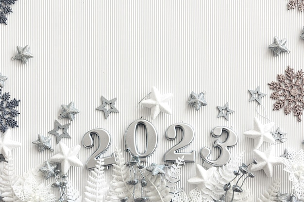 Christmas background with numbers 2023 and decor on a white background