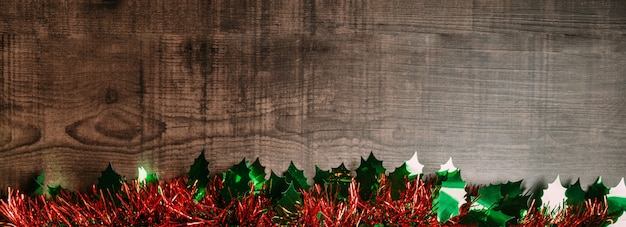 Christmas background with ornament over wooden table. Flat lay for banner.