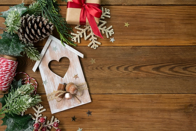 Christmas background with red gift boxes, fir branches and winter decoration.