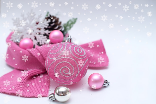 Christmas background with spruce branches and pink Christmas tree toys