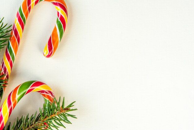 Christmas background with traditional sweets and hot chocolate cups flat lay top view