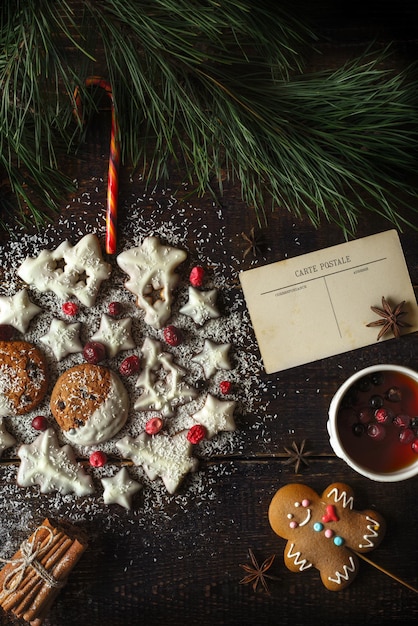 Christmas ball made by cookies on the wooden background with different accessorizes