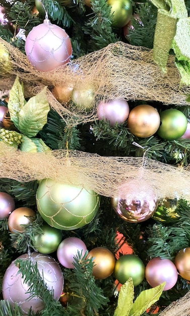 Christmas ball on tree Closeup on Christmas tree decoration over festive background