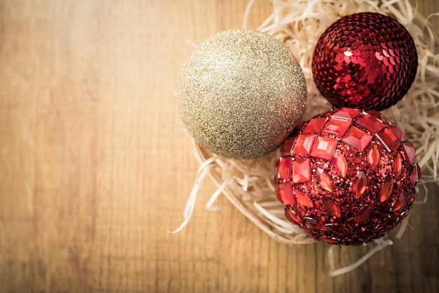 Christmas balls on brown wooden background. Christmas card