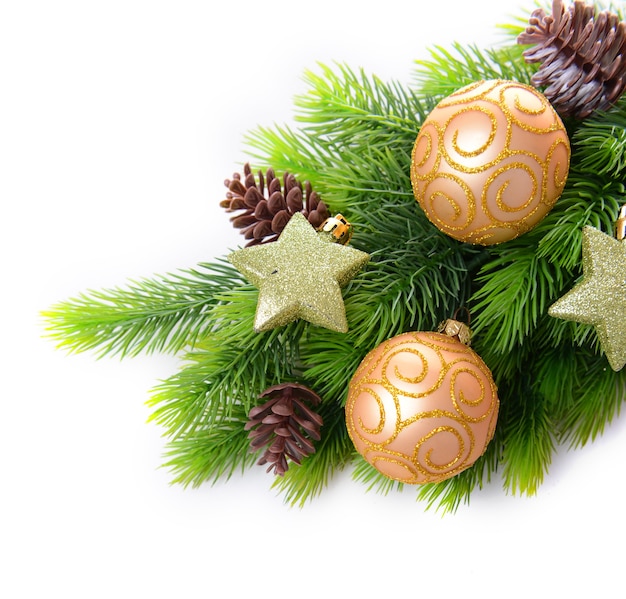 Christmas balls and decorative stars on fir tree, isolated on white