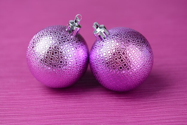 Christmas balls on purple background