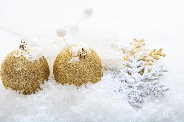 Christmas balls and snow on white background