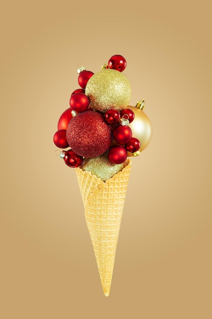 Christmas balls in a waffle cone on a beige background