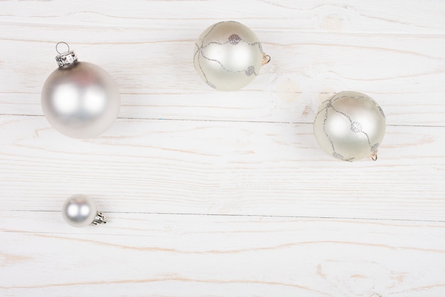 Christmas balls on a white wooden 