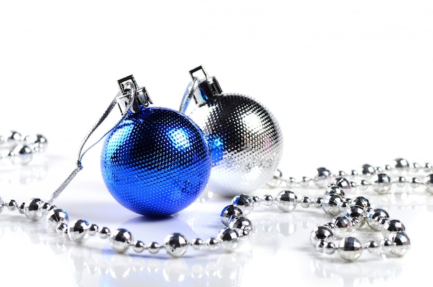 Christmas balls with ornaments on white background.