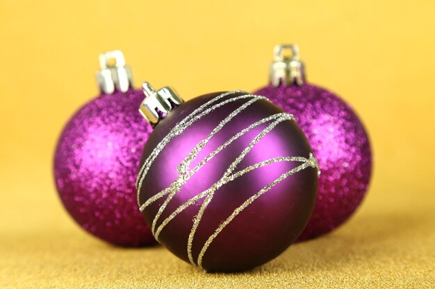 Christmas balls on yellow background