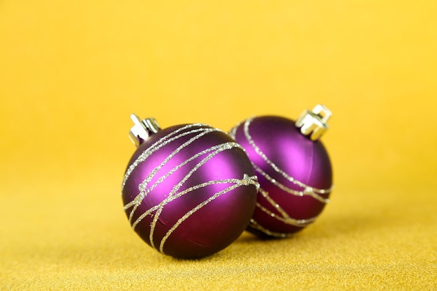 Christmas balls on yellow background